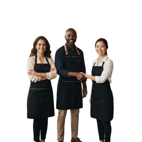 Lächelnde Franchisepartner in Schürzen